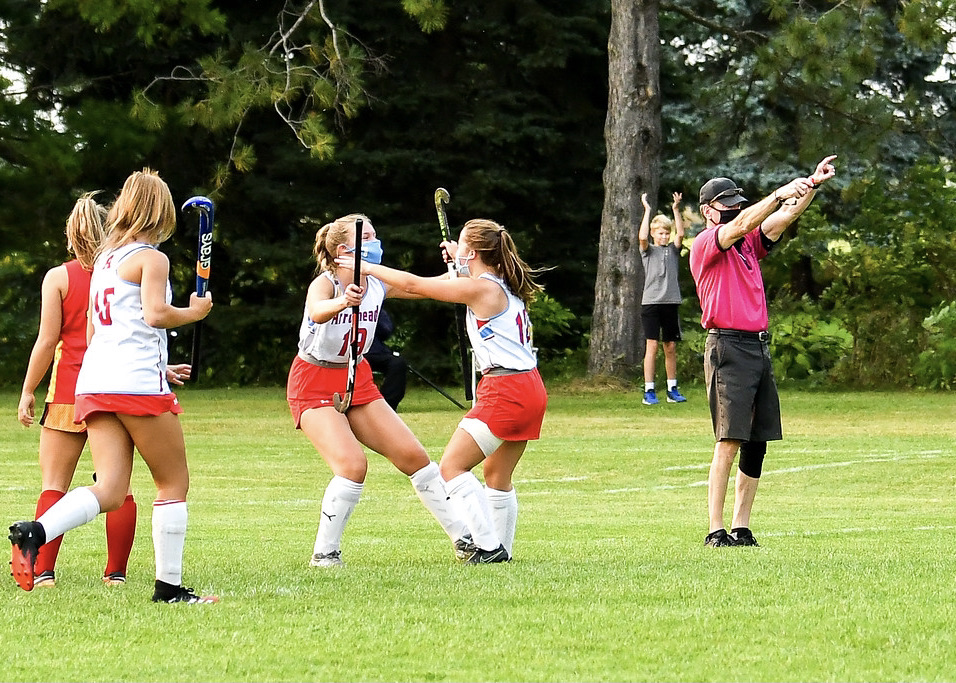 arrowhead field hockey teammates in a game