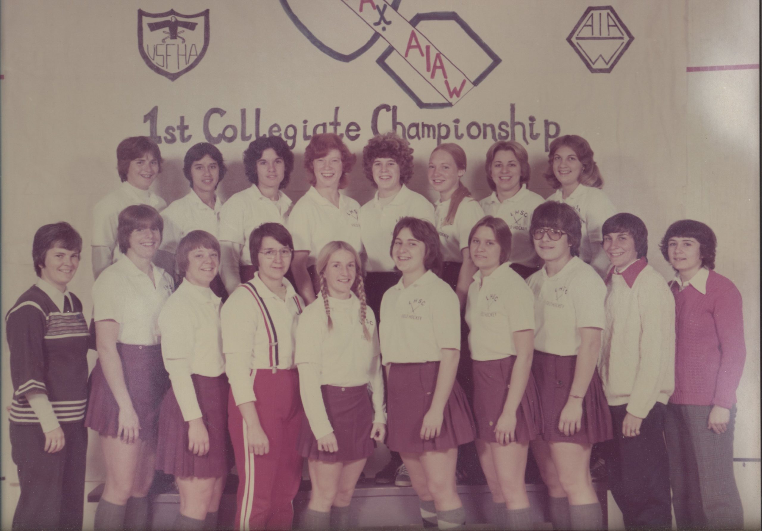 sharan e. taylor smiling alongside her teammates in a team photo